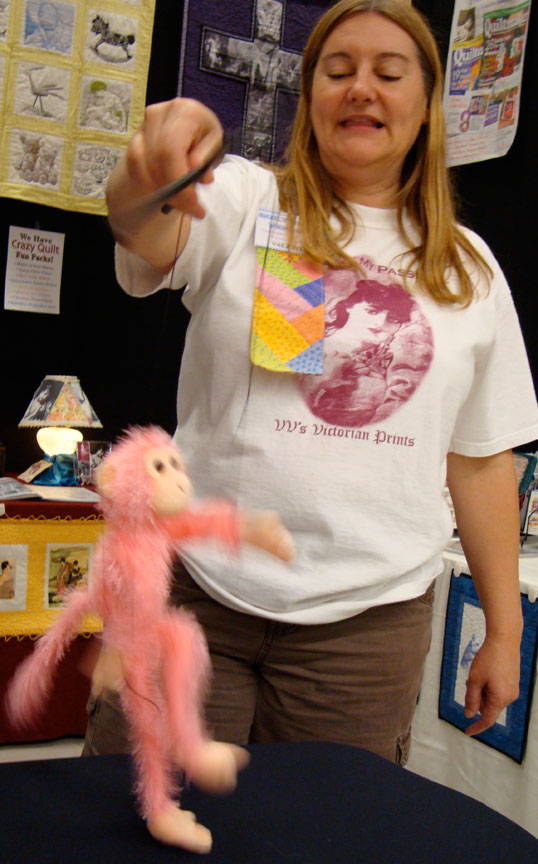 [Val playing with puppet in Leavenworth at Leavenworth's annual quilt show]